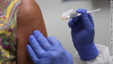 Scarce coronavirus vaccine should go to frontline health workers first, report suggests
