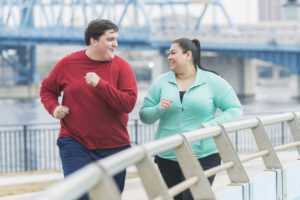 overweight couple exercising