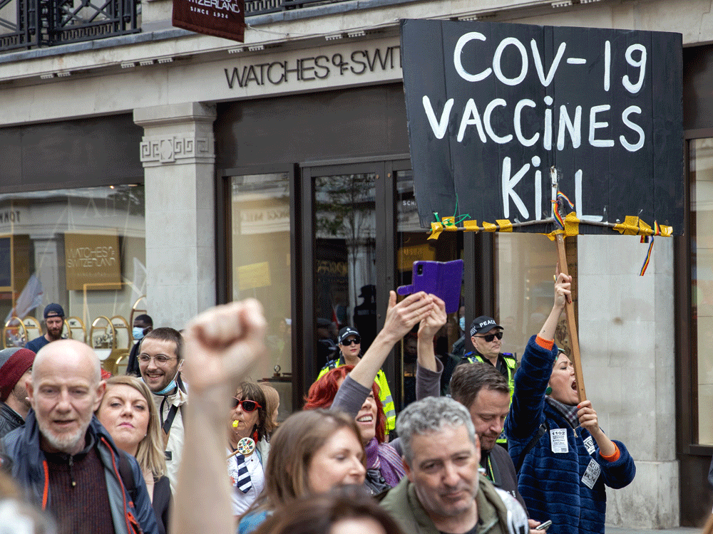 Anti-vaccine protestors in London, England. Roughly 10 per cent of Canadian adults polled said a flat out "no" to getting a COVID vaccination.